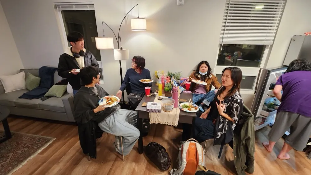 Friends gathered around a table for dinner
