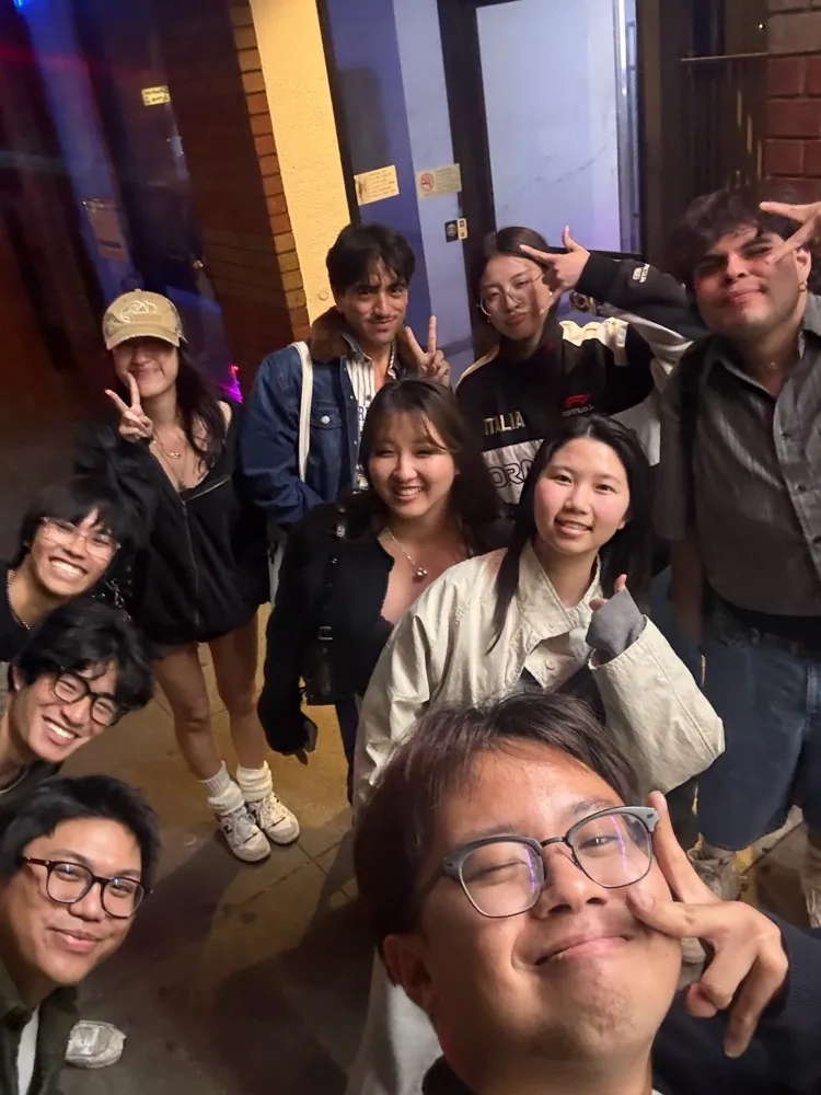A big group selfie at night