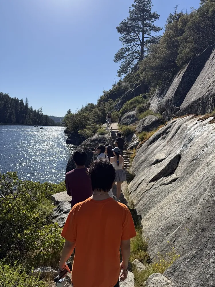 Hiking a rocky trail beside a lake