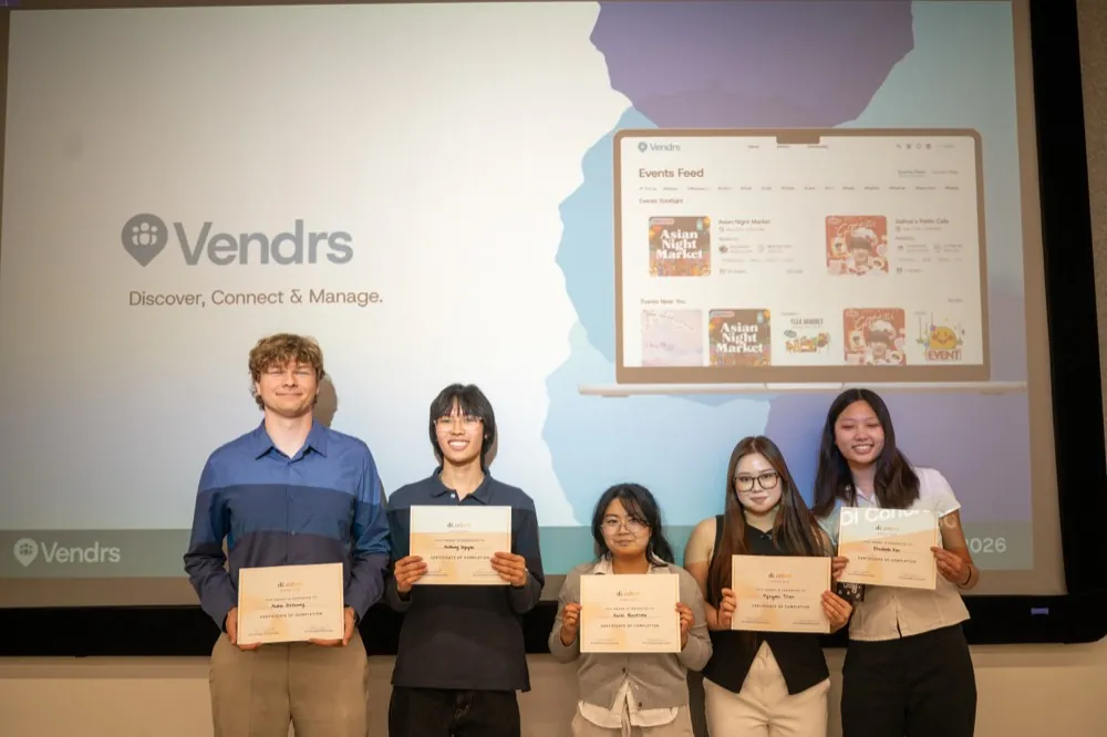 The Vendrs team holding certificates in front of the project slide