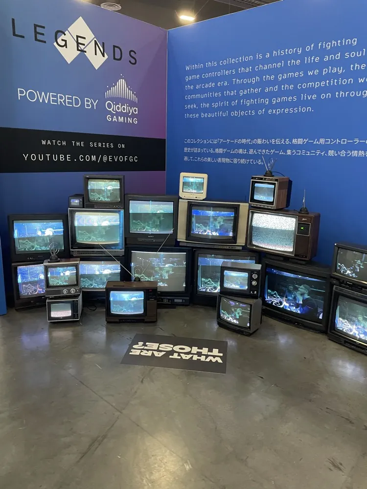 A wall of old CRT TVs in an exhibit at EVO